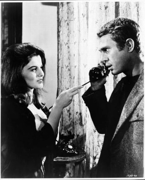 Melba (played by Ann-Margret) flirts with Eric (McQueen).